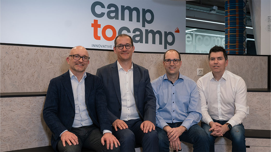 The photo shows the main representatives of Camptocamp and Swisscom. 