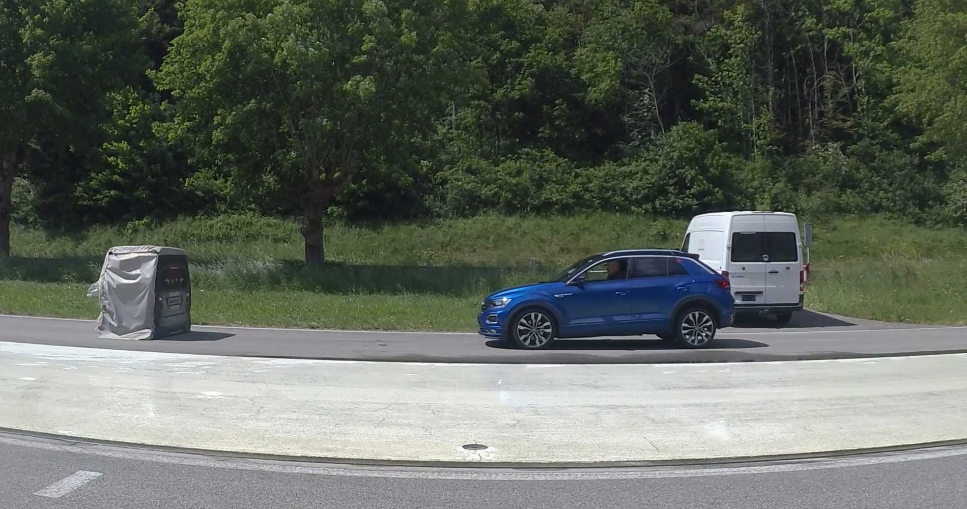Photo shows testing of the automatic emergency braking system on a test track.