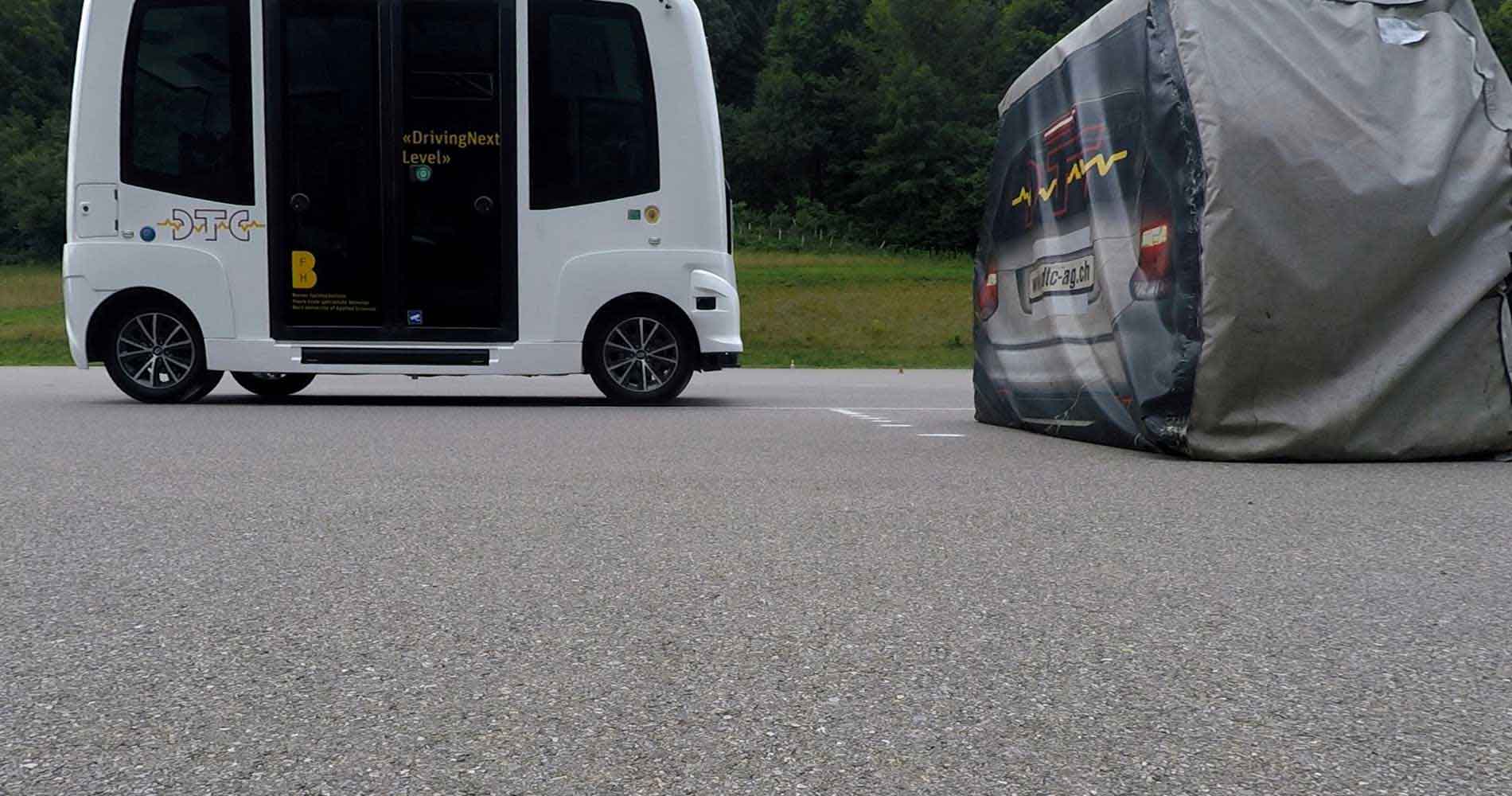 Photo shows DTC road trials being conducted with a driverless test vehicle.