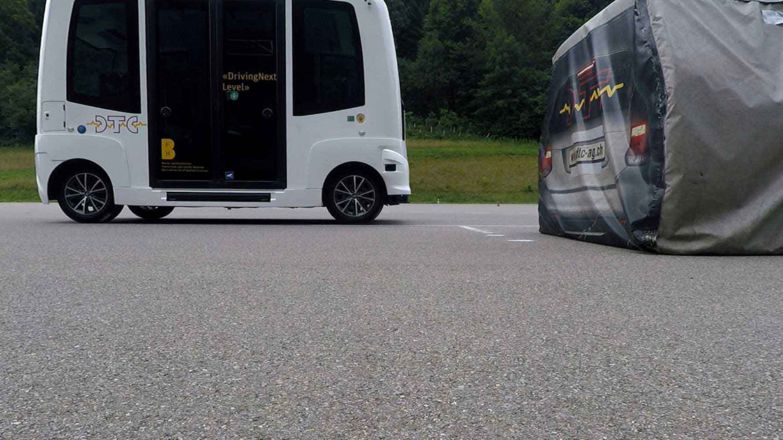 Photo shows DTC road trials being conducted with a driverless test vehicle.