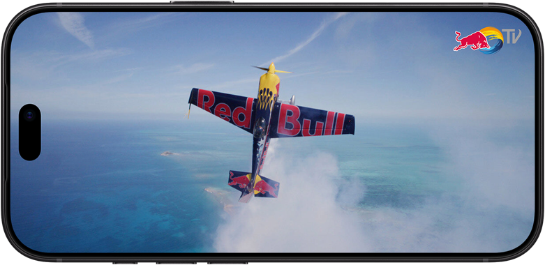 iPhone 18 Pro, landscape mode, Photo of a Red Bull Aerobatic Plane flying vertically in the sky above the sea