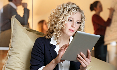 Successful business people with gadgets